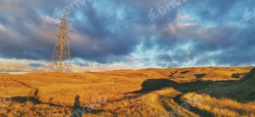 Preview: Bright, sunny sky with fluffy white clouds illuminating a scenic rural landscape