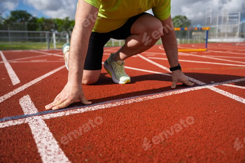Preview: Runner preparing on track at starting line