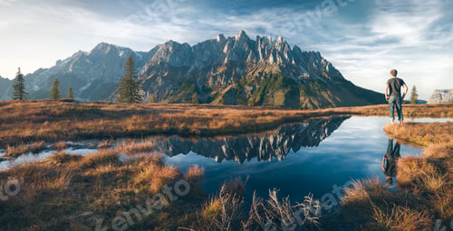 Preview: Austria, Hochkoenig, Mandlwand and man standing at moor pond