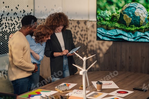 Preview: Happy diverse staff at office with tablet working on pollution reduction
