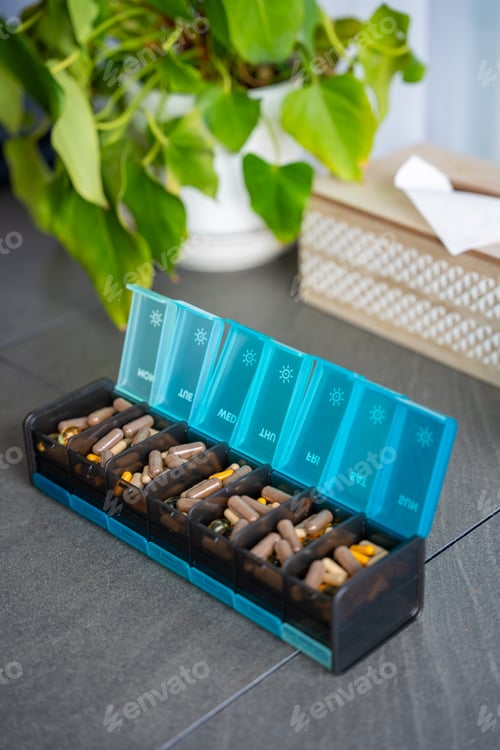 Preview: Weekly pill organizer with labeled compartments for daily medication doses.