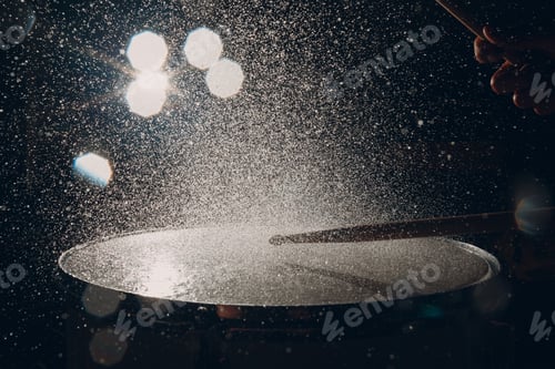 Preview: Drum sticks drumming beat rhythm on drum surface with splash water drops