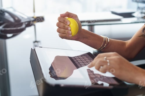 Preview: Stressed Office Worker With Anti Stress Ball Types Email