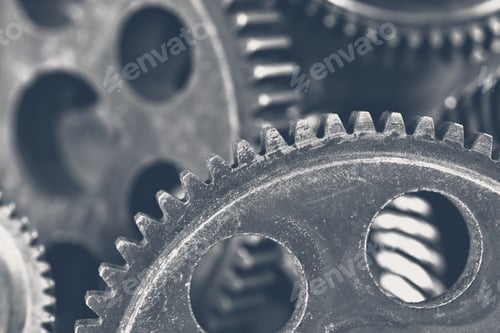 Preview: Close up of metal gears interlocking in a complex machinery setup in a workshop