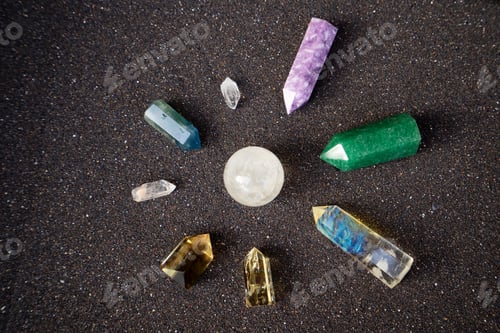Preview: Healing crystals on black sand background