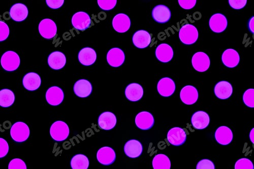 Preview: Unfocused abstract purple bokeh on black background. defocused and blurred many round light