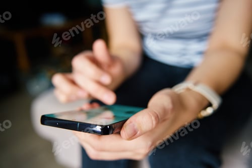 Preview: Person Browsing Social Media on Smartphone Indoors