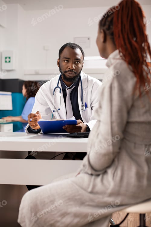 Preview: Doctor Consults Patient in Clinic, White Background