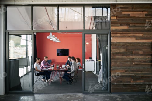 Preview: Making success happen. Shot of a group of colleagues having a meeting in a boardroom.