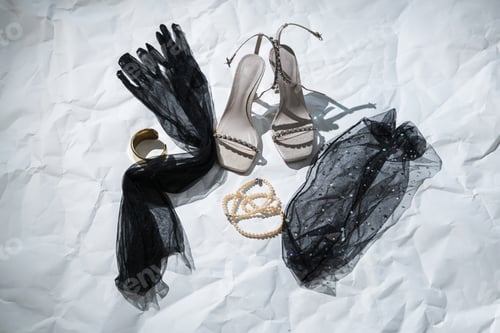 Preview: Elegant Evening Accessories Flat Lay with Heels, Gloves, and Jewelry