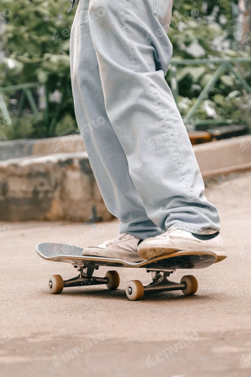 Preview: Portrait of young handsome stylish black man with skateboard. African american skateboarder man. Nat