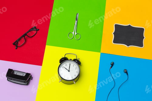 Preview: school supplies at colorful paper background