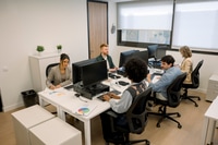 Preview: Diverse business team collaborating in a modern office space