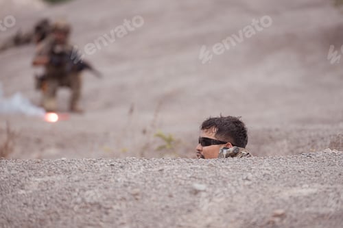 Preview: Soldiers in camouflage military uniforms carrying weapons Reconnaissance missions in rugged mountain