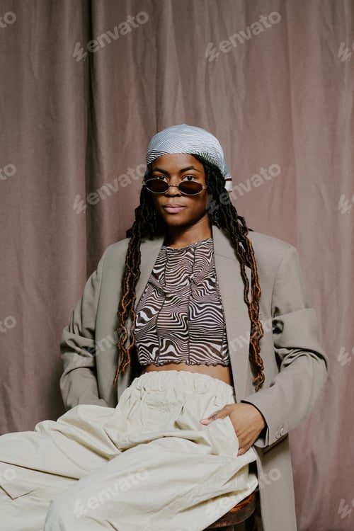 Preview: Portrait of African American Woman Wearing Stylish Outfit Sitting
