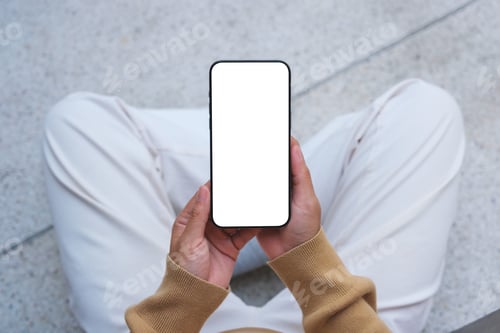 Preview: Top view mockup image of a woman holding mobile phone with blank desktop white screen