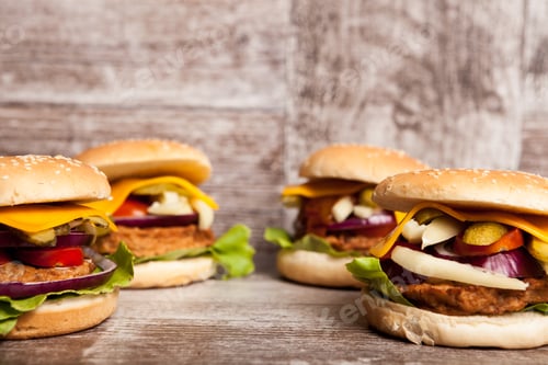 Preview: Delicious home made burgers on wooden plate