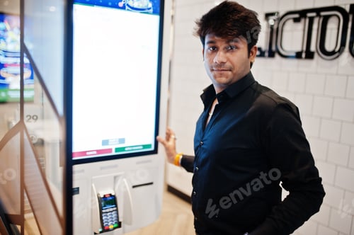 Preview: Indian man at fast food cafe
