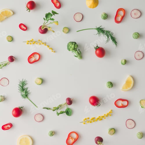 Preview: Colorful food pattern made of lemon, tomoatoes, red pepper and yellow flowers. Flat lay.