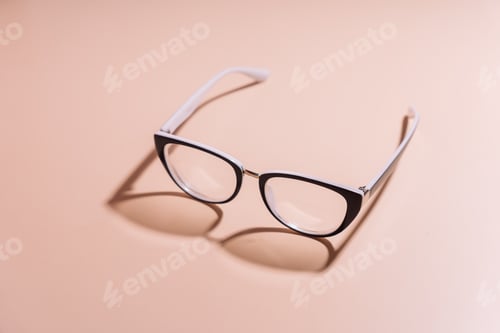 Preview: Vision glasses with black frames on a pink background