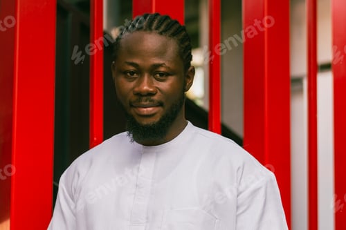 Preview: Cheerful male tourist portrait dress in white wear dashiki ethnic smiling at city street or small