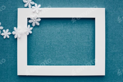 Preview: White frame and snowflakes on a blue background. New year, holiday, decoration