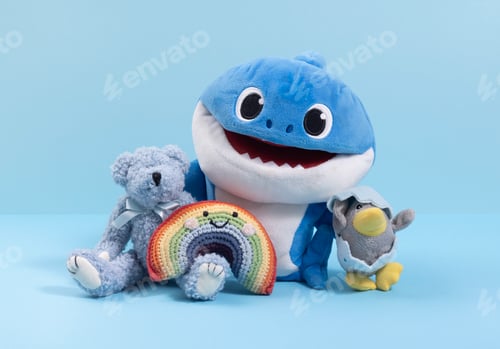 Preview: Different soft toys on a blue background, the concept of friendship and togetherness