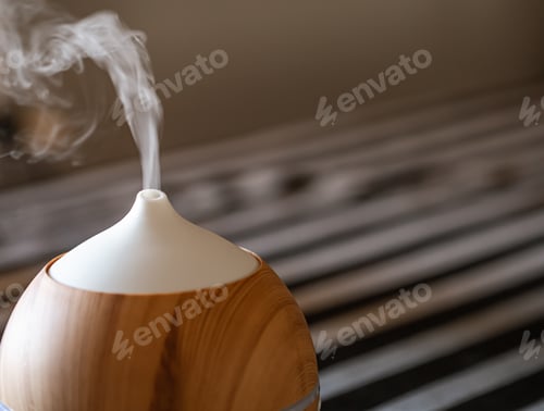 Preview: Modern oil aroma diffuser close up on a blurred background copy space.