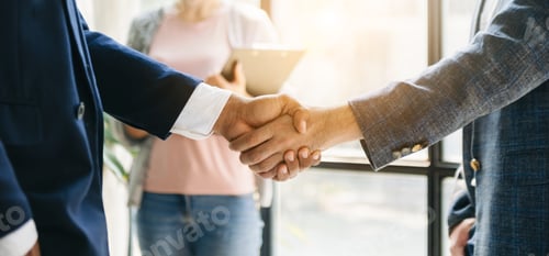 Preview: Business partnership handshake concept.Photo two coworkers handshaking process.