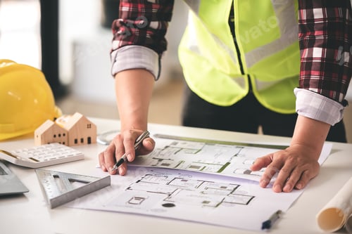 Preview: architect concept, working architect with blueprints in office to present to customers