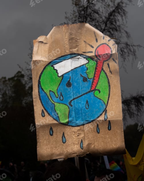 Preview: Vertical shot of an environmental protest poster in Glasgow, Scotland