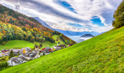 Preview: Astonishing autumn view on suburb of Hergiswil village with mountaines and fog.
