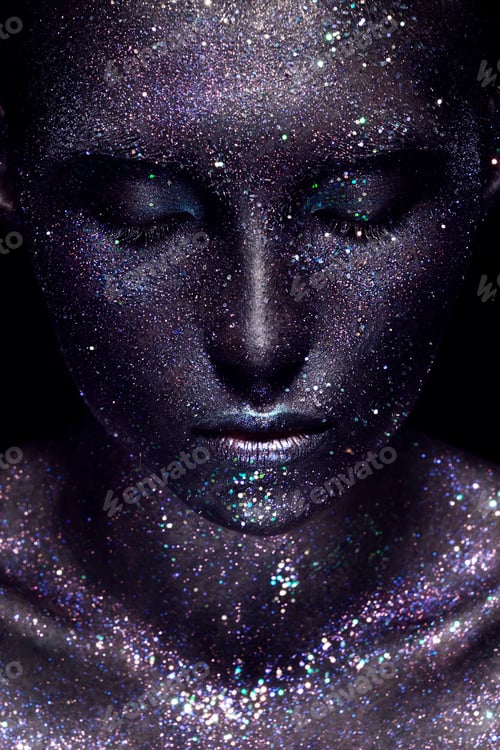 Preview: Portrait of beautiful woman with art space makeup on her face and body. Glitter Face.