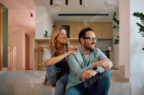 Aperçu: Happy couple enjoying in relaxing day at their new home.