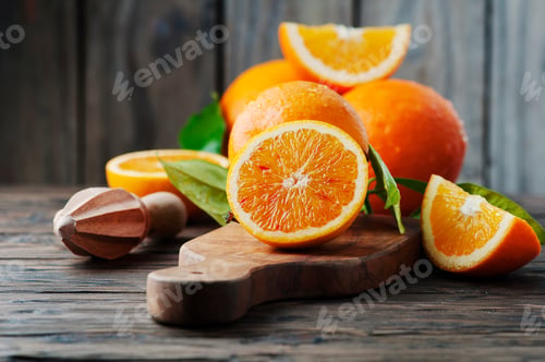 Preview: Fresh sweet oranges on the wooden table