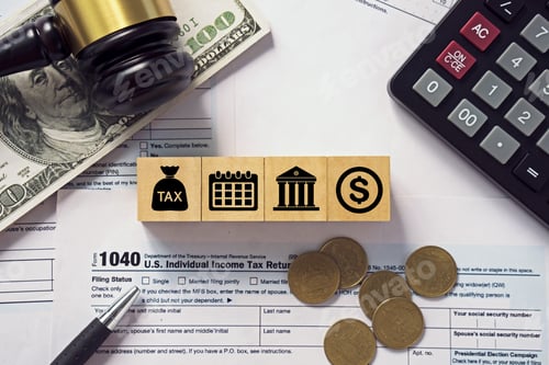 Preview: Tax concept.Tax icon on wooden block.Calculator with money on 1040 tax form.Income tax return.