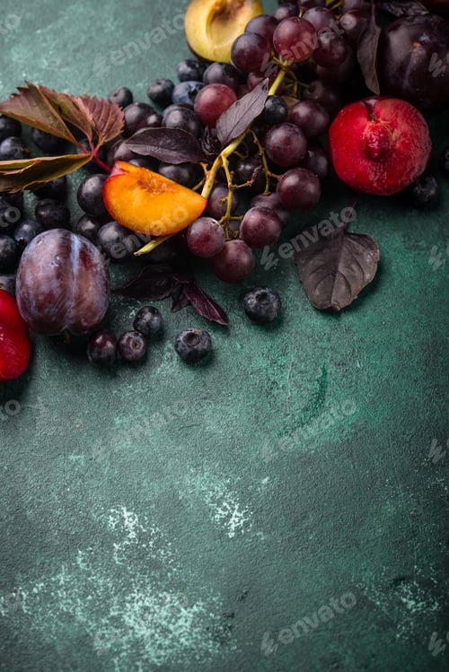 Preview: Assortment of purple fruit plum, grape, blueberry and basil