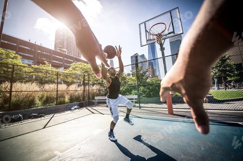 Preview: Two street basketball players playing hard on the court