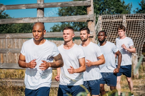Preview: portrait of multicultural young soldiers running on range