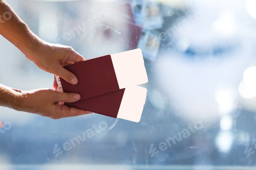 Preview: Closeup passports and boarding pass at airport indoor near big window
