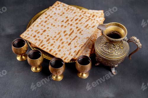Preview: Passover background four glasses wine and matzoh jewish holiday bread over wooden board.