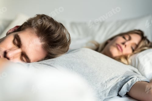 Preview: couple sleeping in bed