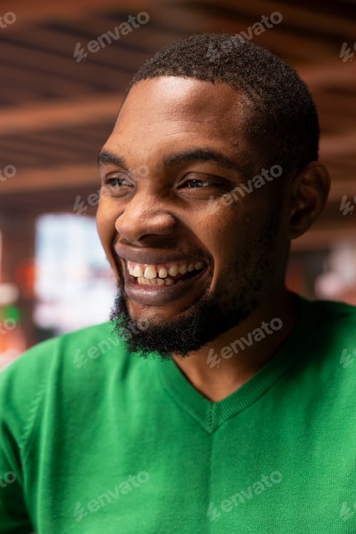 Preview: Portrait of jolly man at home feeling happy and grateful in life