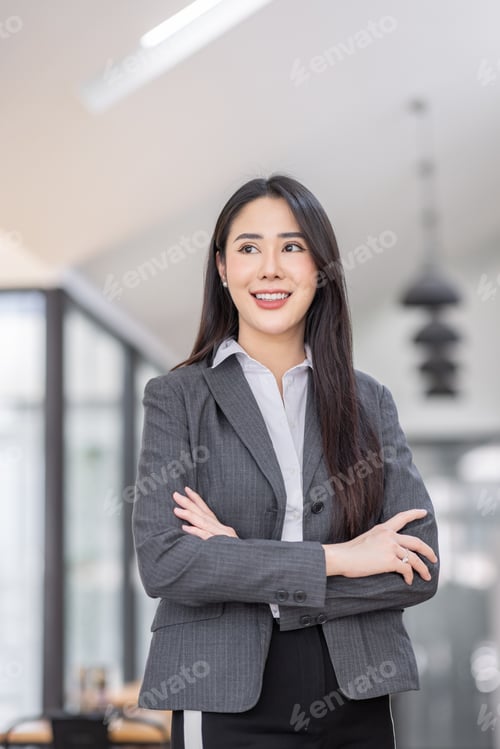Preview: Portrait of successful business asian women in suit with arms crossed and smile isolated over white