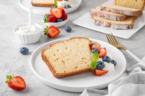 Preview: Vanilla pound cake served with fresh berries and whipped cream. Selective focus, copy space.