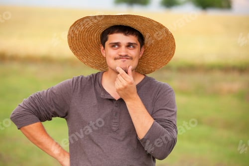 Preview: Surprised farmer at wheat field