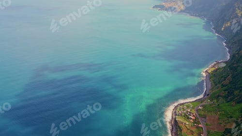 Preview: Aerial turquoise ocean water in scenic serene lagoon. Green mountain slopes