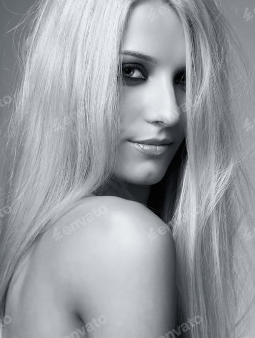 Preview: Monochrome Portrait Of Blonde Young Woman On Gray Background