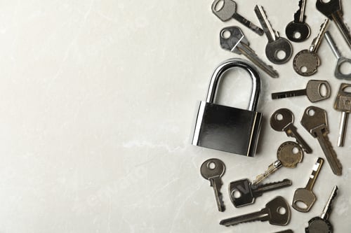 Preview: Steel padlock and keys on marble background, flat lay with space for text. Safety concept