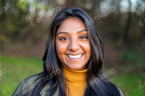 Preview: Portrait of a yong Indian woman in the nature, head in a public park
